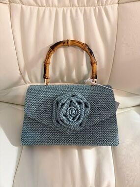Sophisticated Blue Clutch Bag with Handcrafted Floral Detail